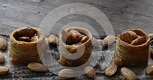 Turkish sweets with almonds, honey nests with almonds, almonds sweets