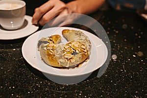 Turkish sweets - sweet bagel with filling sprinkled with pieces of nuts