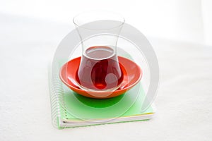 Turkish Tea Glass On The Small Notebook