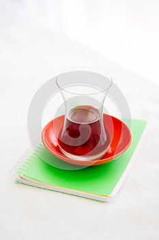 Turkish Tea Glass On The Small Notebook