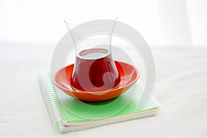 Turkish Tea Glass On The Small Notebook