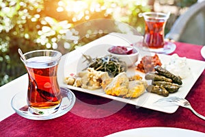 Turkish tea and meze in restaurant photo