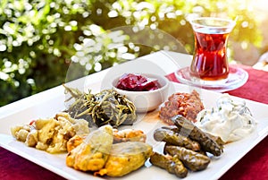 Turkish tea and meze in restaurant photo
