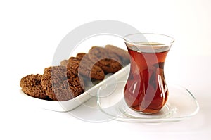 Turkish tea in traditional glass with cookie
