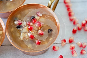 Turkish traditional dessert Ashura, Noah`s pudding on wooden ba