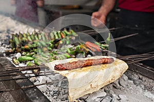 Turkish traditional kebab with pita bread on a bbq in taste of food festival in the city of Adana of Turkey country