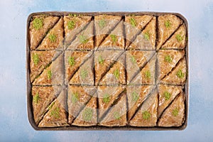 Turkish traditional Pistachio Baklava dessert, baklava on tray. Food pastry shop background photo