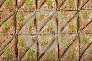 Turkish traditional Pistachio Baklava dessert, baklava on tray. Food pastry shop background photo