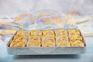 Turkish traditional Pistachio Baklava dessert, baklava on tray. Food pastry shop background photo