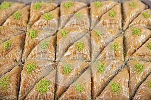 Turkish traditional Pistachio Baklava dessert, baklava on tray. Food pastry shop background photo