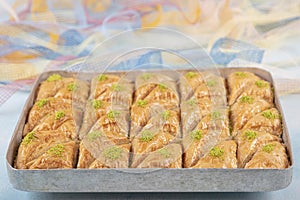 Turkish traditional Pistachio Baklava dessert, baklava on tray. Food pastry shop background photo