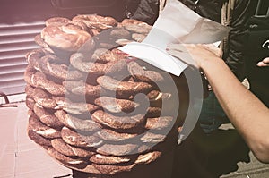 Turkish traditional sesame bagels sailing on street, Istanbul, Turkey. Simit is a traditional Turkey bagel on breakfast