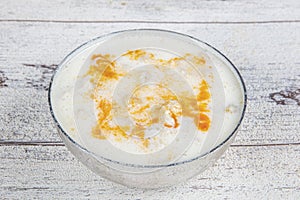 Turkish Traditional Tripe Soup with bread on white rustic wooden background. tripe, head, paca soup