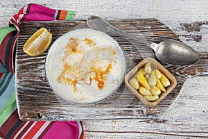 Turkish Traditional Tripe Soup with bread on white rustic wooden background. tripe, head, paca soup