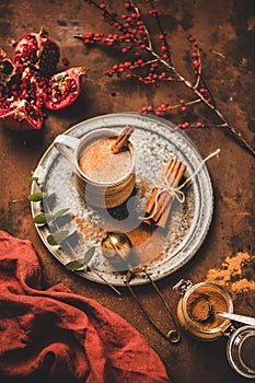Turkish traditional wintertime hot drink Salep in mug with cinnamon