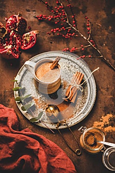 Turkish traditional wintertime hot drink Salep in mug with cinnamon photo