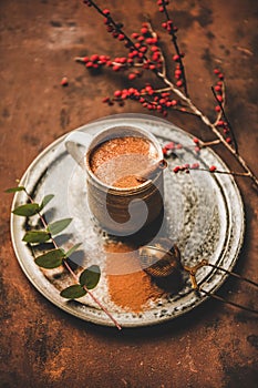 Turkish traditional wintertime hot drink Salep in mug on tray