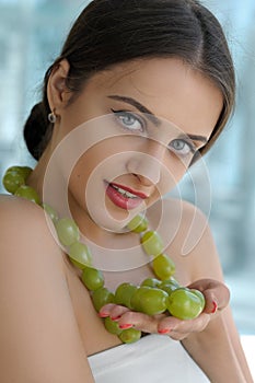 Turkish woman made decorations from the living grapes.