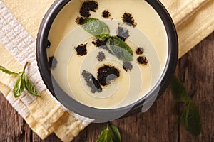 Turkish Yayla soup with rice, mint and yoghurt close-up. horizon
