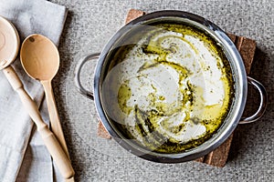 Turkish Yayla or Yogurt Soup with mint sauce in pan / Tzatziki.