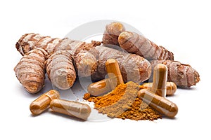 Turmeric capsule, curcuma powder and tumeric rhizome,Curcuma longa, isolated on white background. curcumina