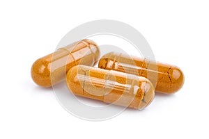 Turmeric capsules isolated on white photo