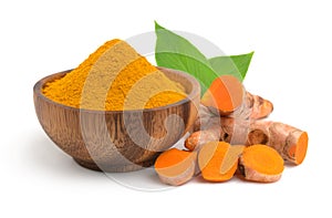 Turmeric Curcuma longa Linn, curcumin  powder in the wooden bow and rhizomes root sliced with leaves isolated on white