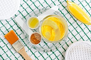 Turmeric and greek yogurt sour cream or kefir facial mask with lemon and olive oil. Homemade beauty treatments recipe.