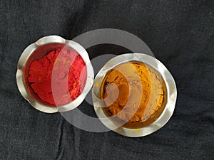 Turmeric and Kumkum Cup isolated on Black Background