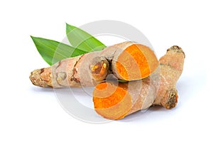 Tumeric  Turmeric  root with green leaves isolated on white