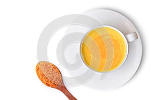 Turmeric milk on white background.