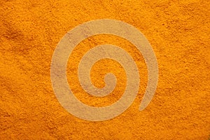 Turmeric powder background. Macro photo