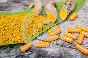 Turmeric powder ,capsules , roots and leaf, curcumin herb medicine