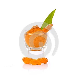 Turmeric Powder with Glass on White background photo