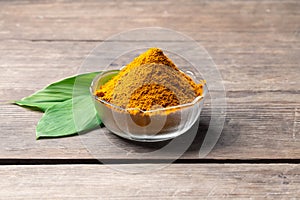 The turmeric powder is a natural herb and is an ingredient for food cooking. The colour of the turmeric powder is yellow when it