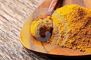 The turmeric powder is a natural herb and is an ingredient for food cooking. The colour of the turmeric powder is yellow when it