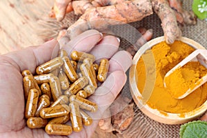 Turmeric powder with tumeric capsules for health.