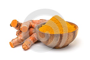 Turmeric powder and turmeric (curcumin) rhizomes on a white background.