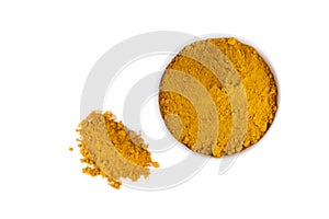 Turmeric powder in white ceramic bowl