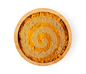 Turmeric powder in wood bowl on white background