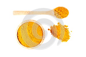 Turmeric powder in wooden bowl