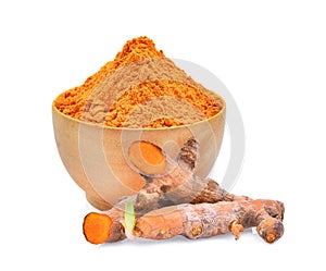 Turmeric powder in wooden bowl on white
