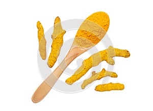 Turmeric powder in wooden spoon and dry roots isolated on white background.