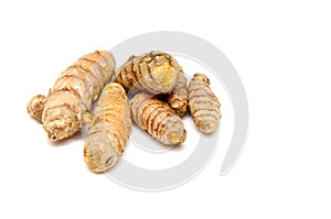 Turmeric rhizomes on white photo