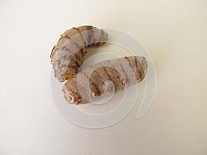 Turmeric rhizomes on a wooden board photo