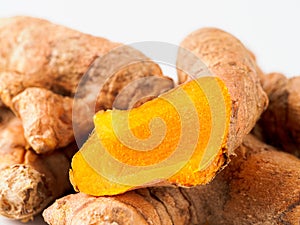 Turmeric root close up, white background