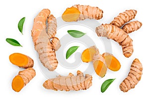 Turmeric root and slices isolated on white background. Top view. Flat lay