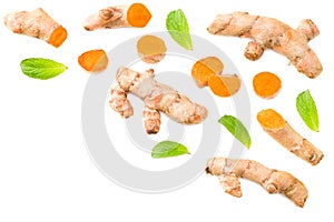 Turmeric root with turmeric slices isolated on white background. Top view