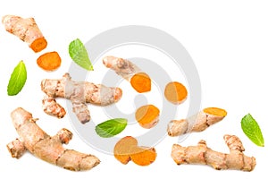 Turmeric root with turmeric slices isolated on white background. Top view