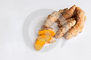 Turmeric root on white background photo